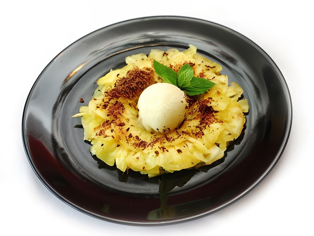 Grilled Pineapple with Black Pepper, Ice Cream, and Honey-Orange Sauce