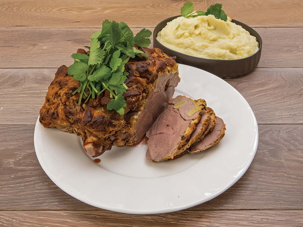 Leg of Lamb Baked in Mustard and Herb Crust with Mashed Potatoes