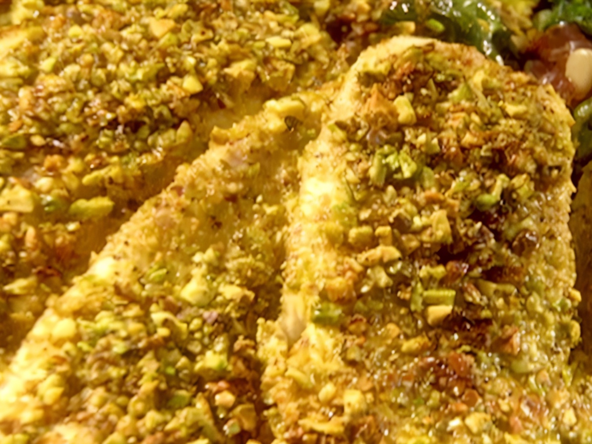 Dorado with Pistachio Crust, Swiss Chard, Cooked Ham, Gorgonzola Cheese, and Pine Nuts