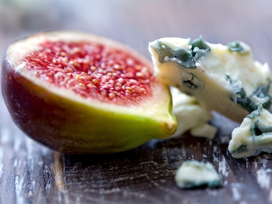 Grilled Fig Stuffed with Goat Cheese in Grape Leaves, Drizzled with Honey