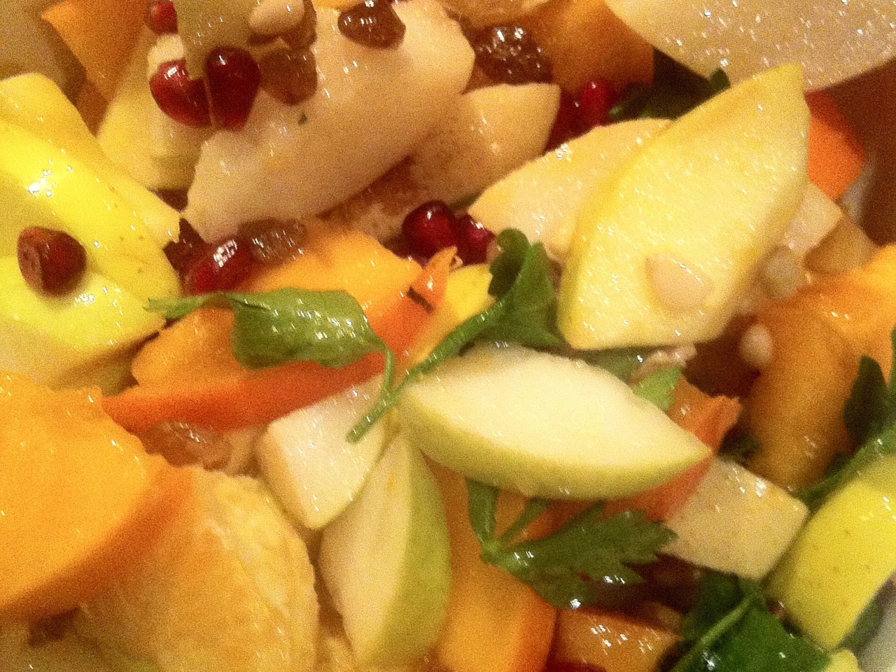 Fruit Salad with Pomegranate Seeds and Greens