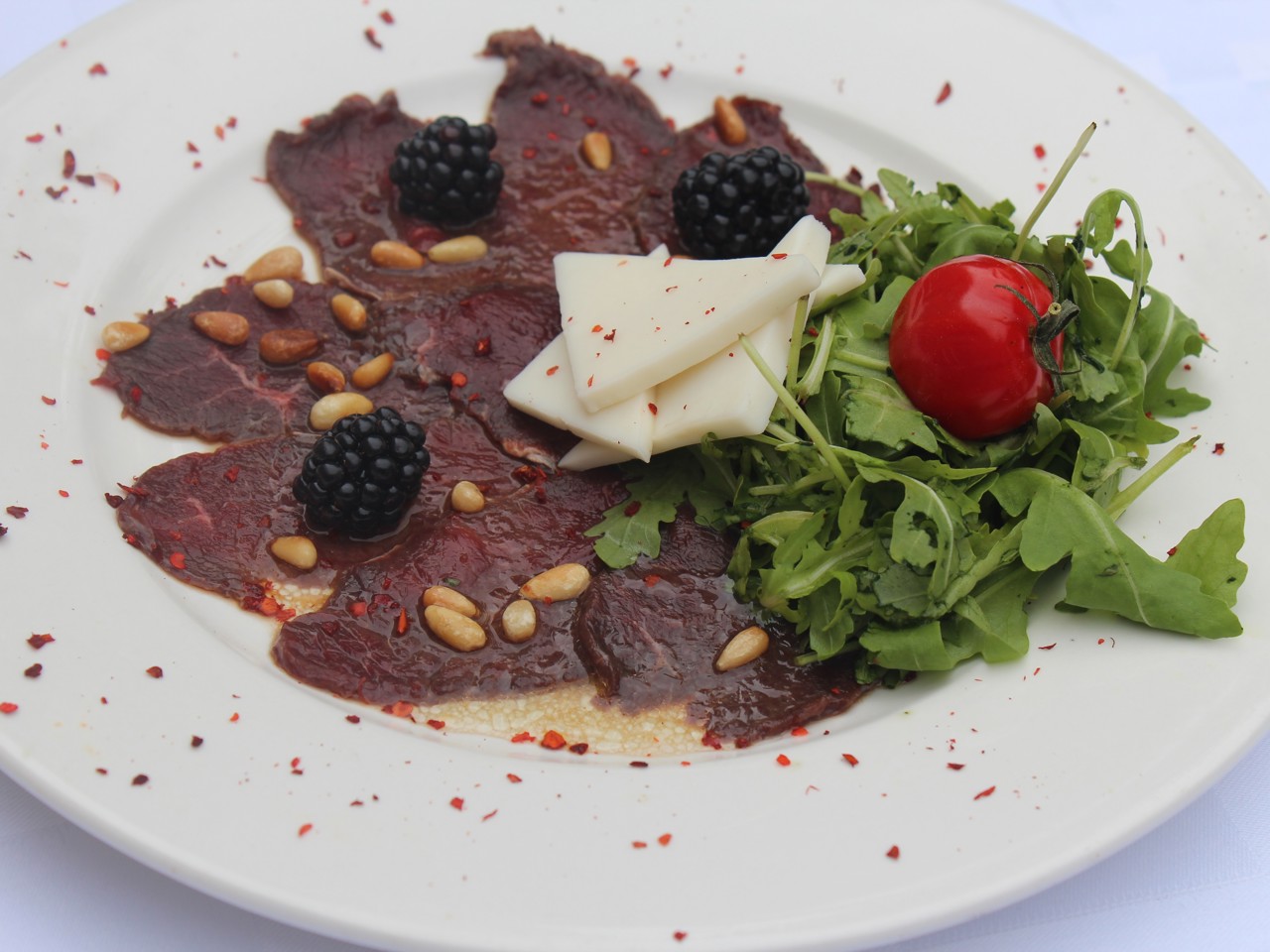Reindeer Carpaccio with Goat Cheese and Arugula