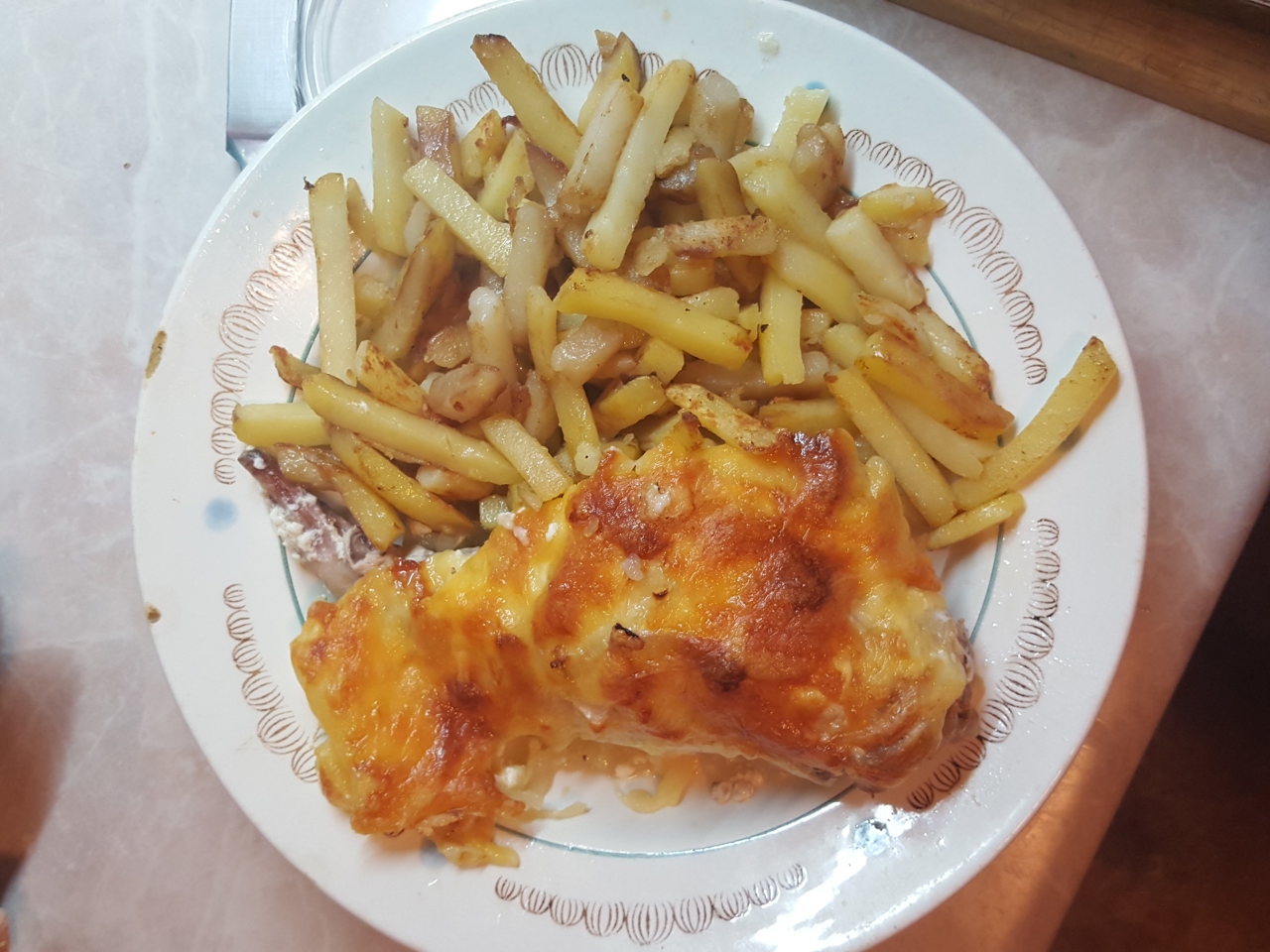 Rabbit Baked with Sour Cream and Cheese