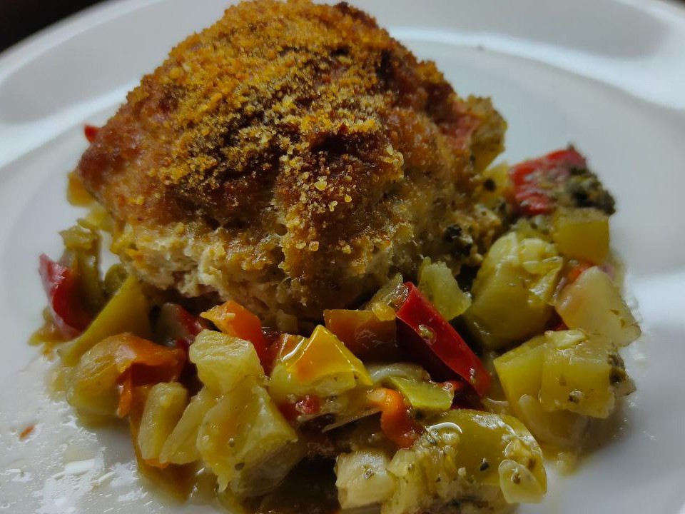 Chicken Meatballs with Tomato and Onion on a Vegetable Bed