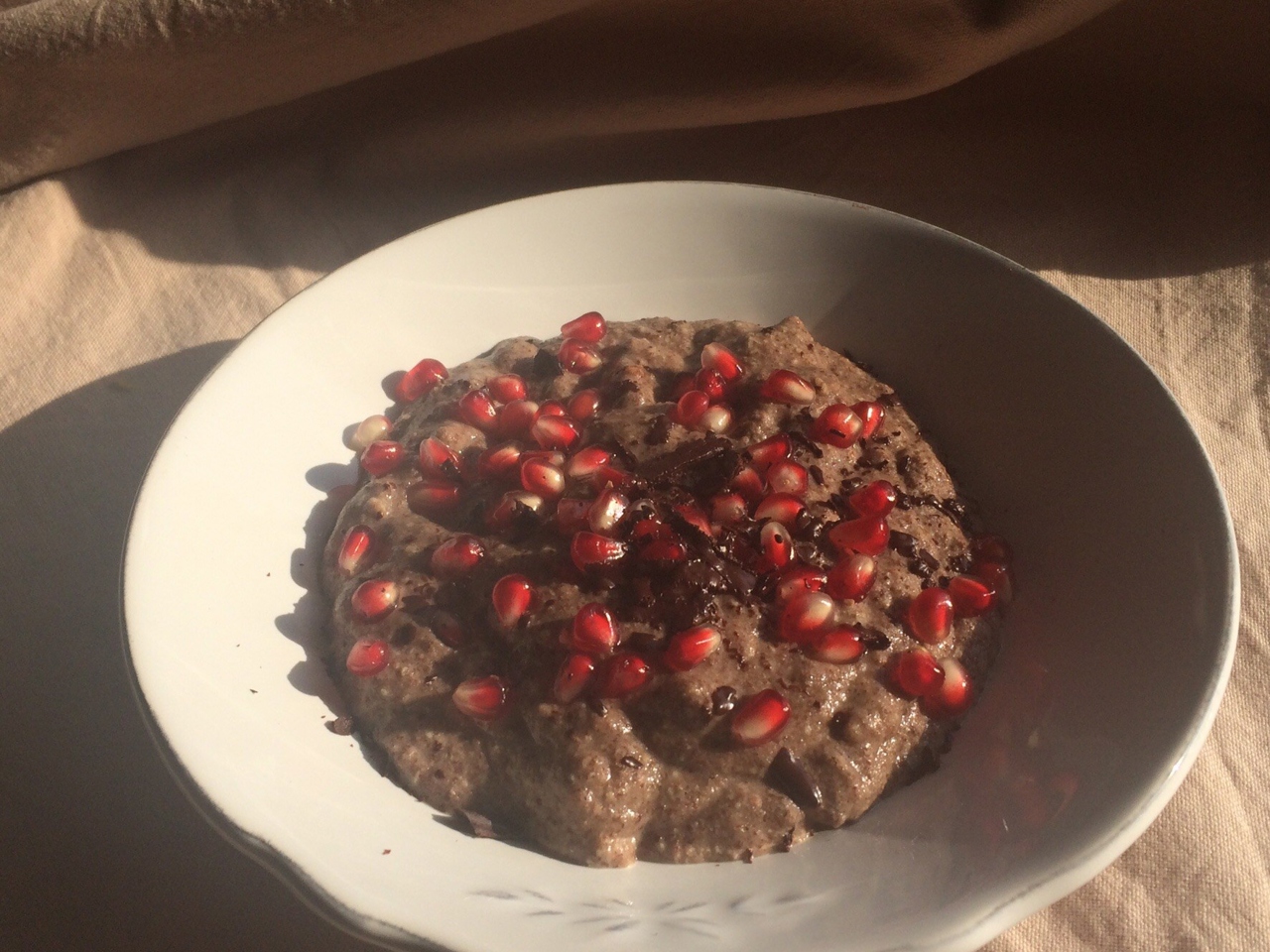 Flaxseed Porridge with Pomegranate and Chocolate Crumble