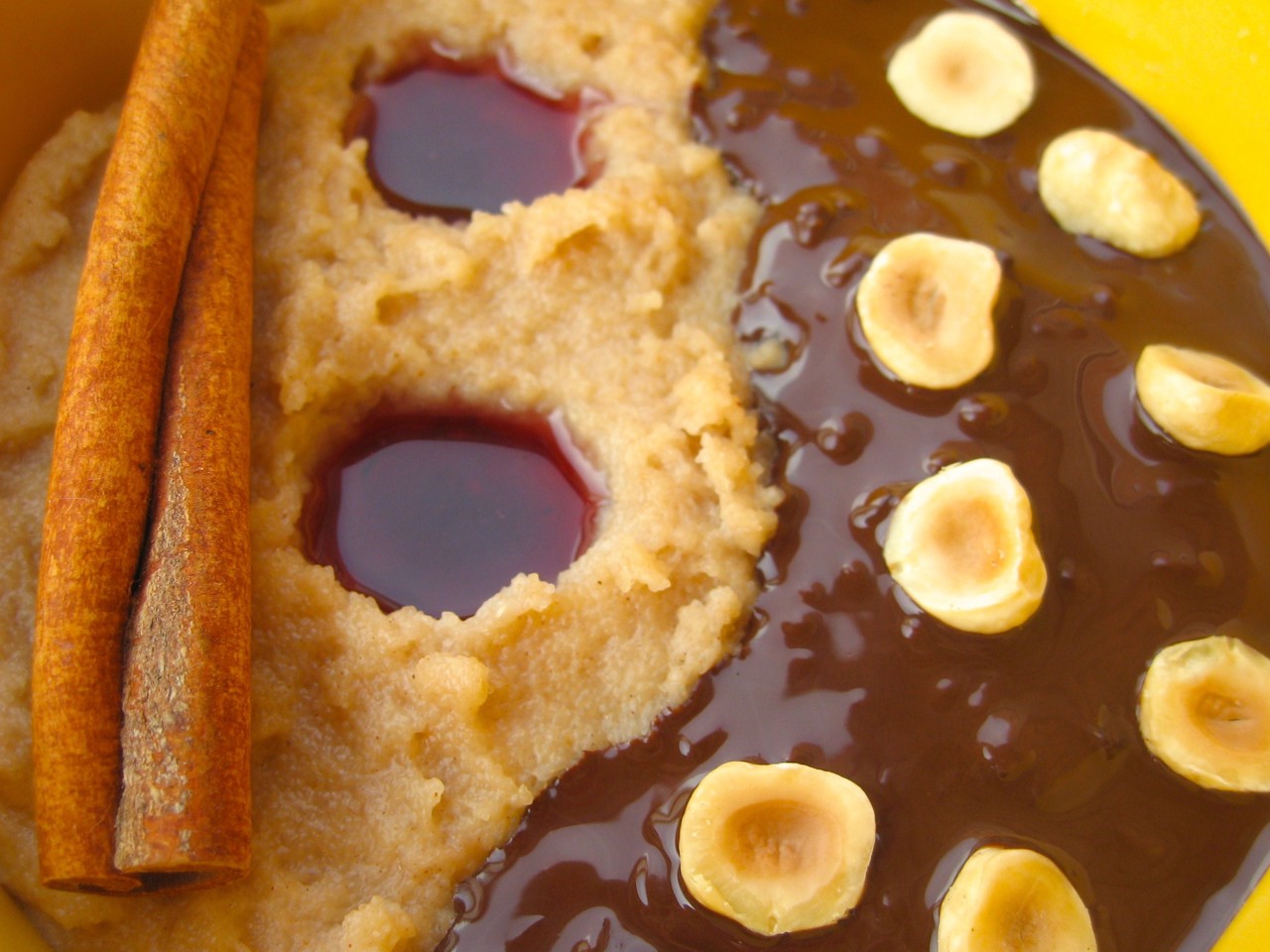 Semolina Porridge with Hazelnuts, Dark Chocolate, and Cranberry-Pomegranate Sauce