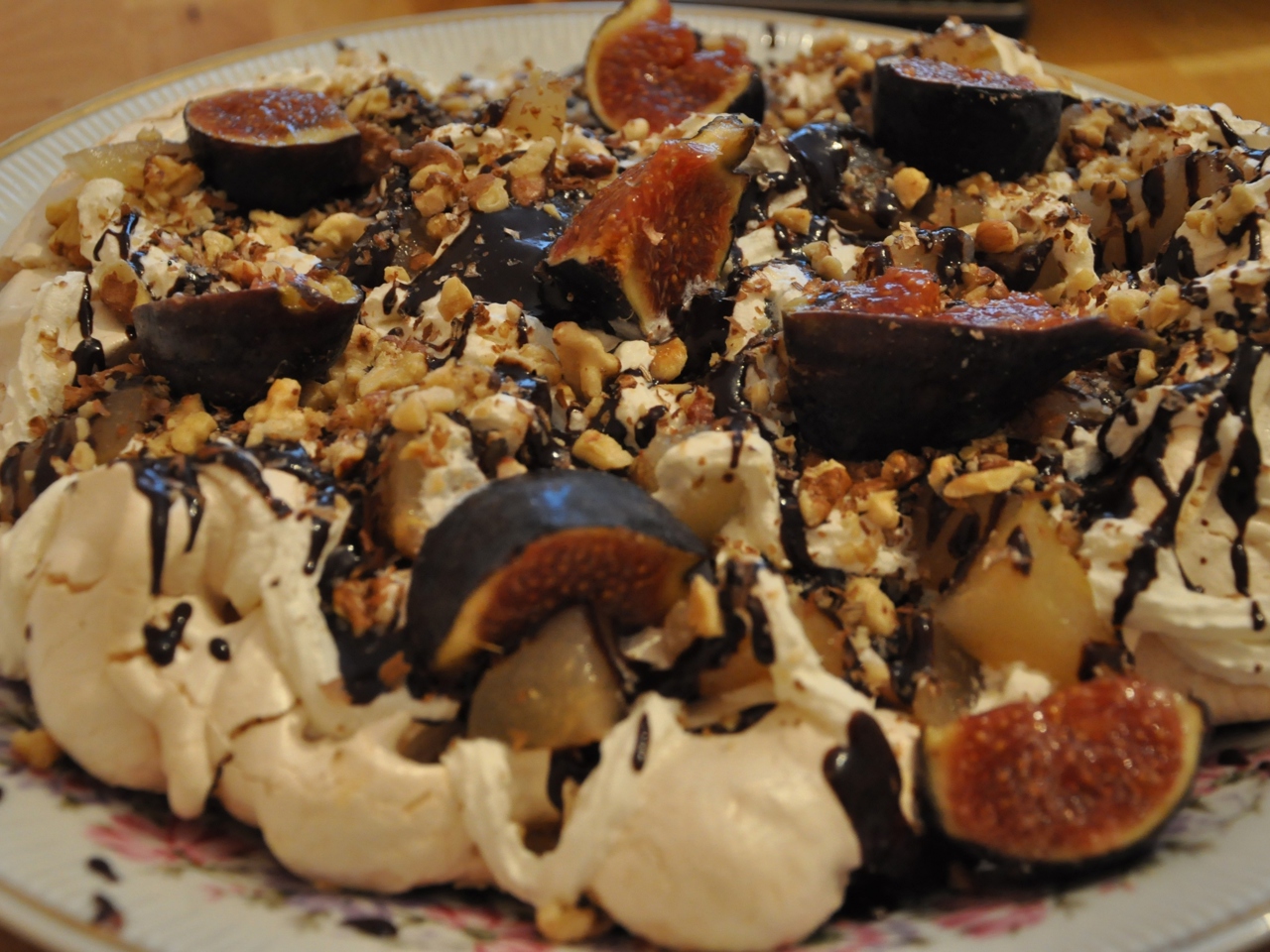 Meringue with Pears, Cream, Walnuts, and Chocolate Sauce