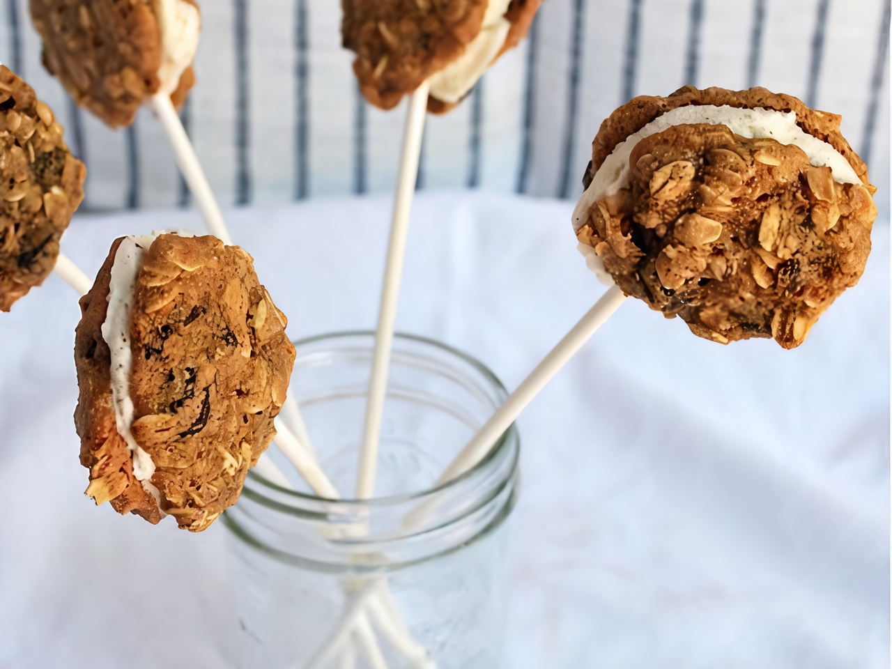 Mini Sandwiches with Oatmeal Cookies and Cinnamon Ice Cream on a Stick