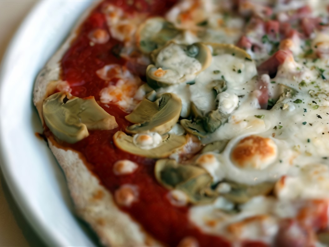 Pizza with Cod Liver, Mushrooms, and Hazelnuts