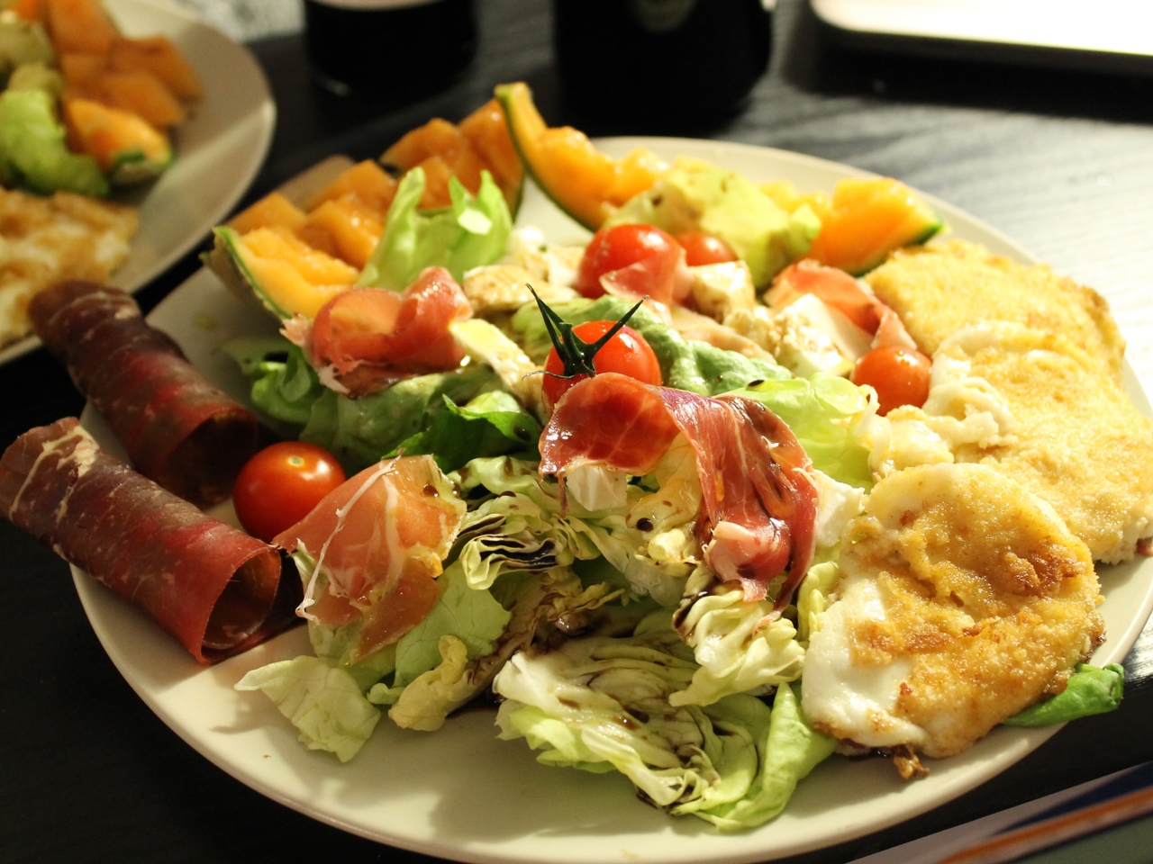Italian Salad with Melon Wedges, Breaded Mozzarella, and Balsamic Sauce