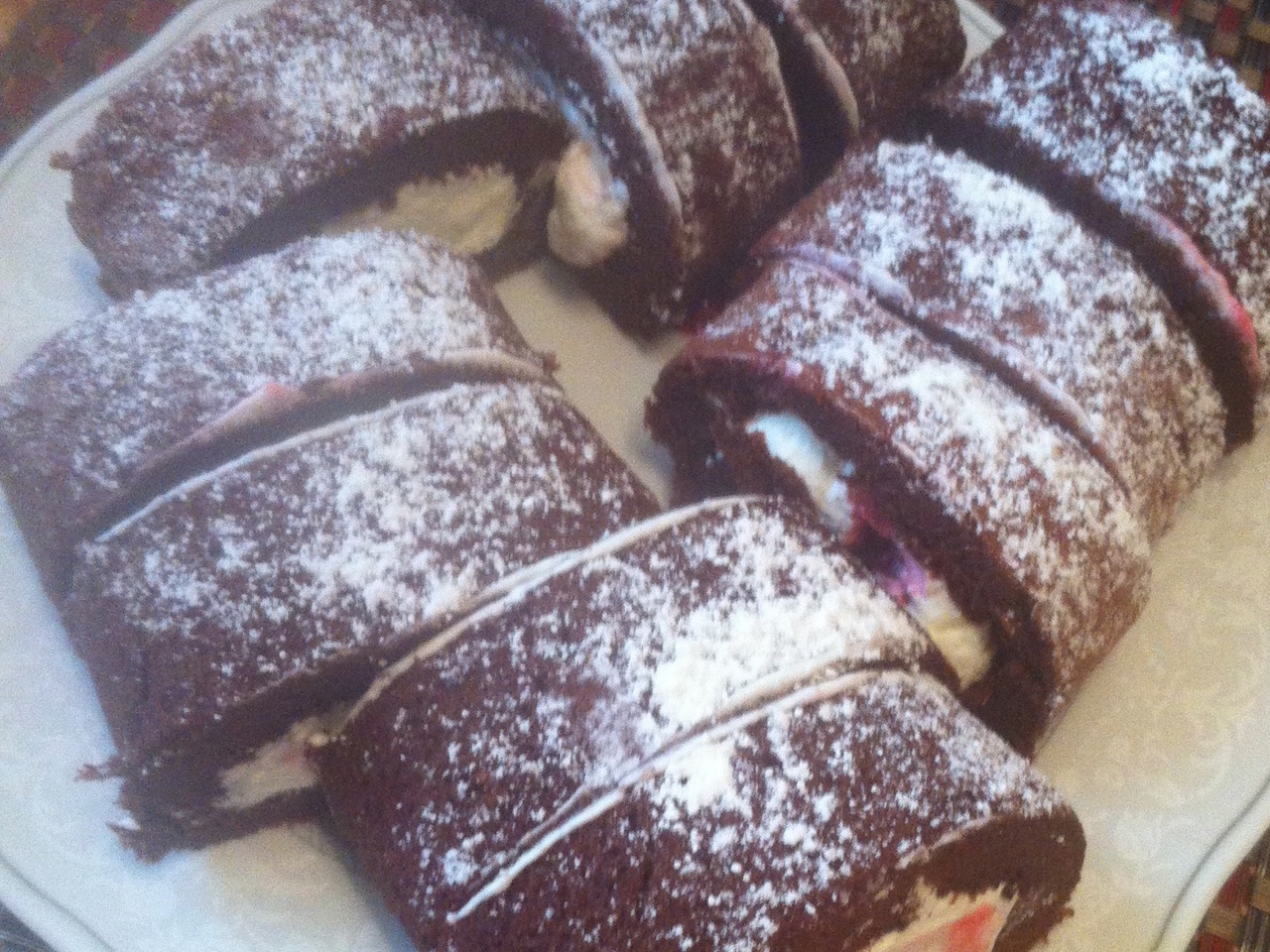 Chocolate Roll with Cherry and Whipped Cream