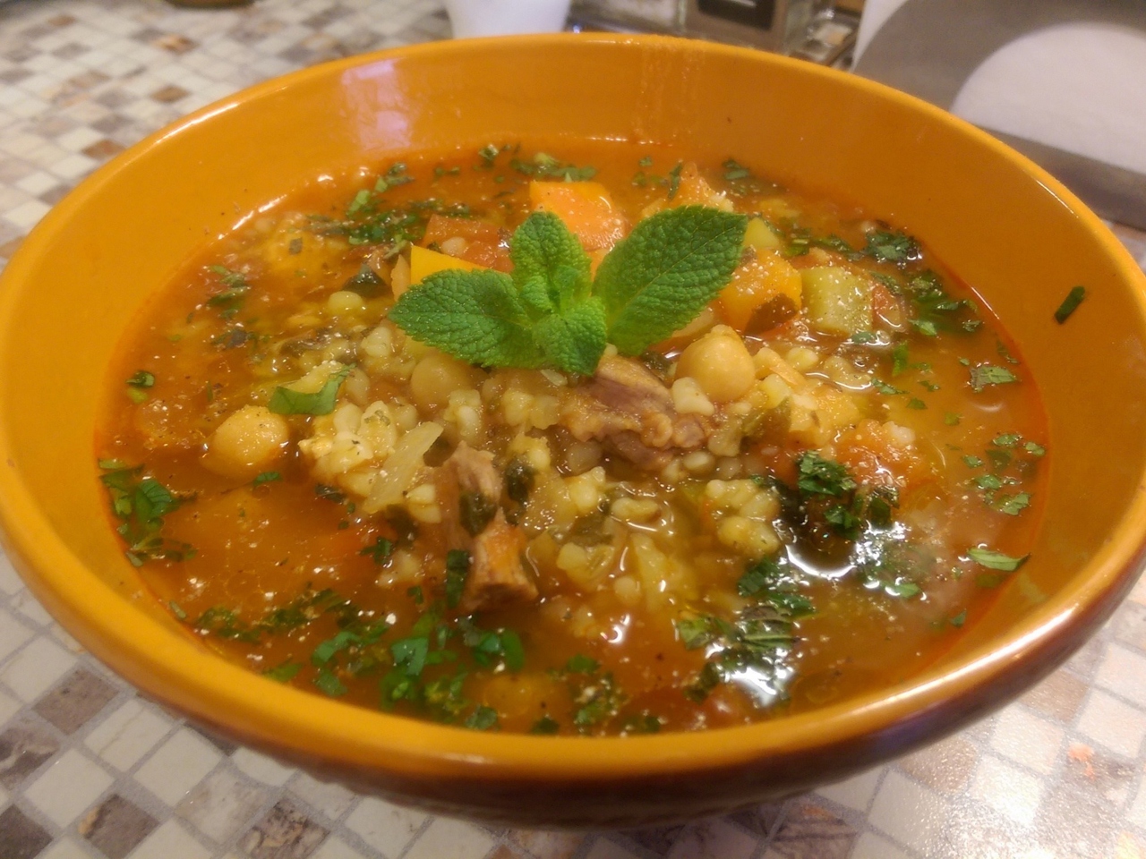 Algerian Shorba. Thick stew with lamb, chicken, chickpeas, vegetables, and spices