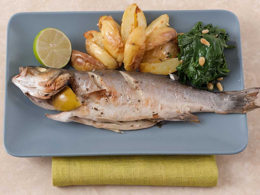 Milanese Sea Bass Baked with a Bouquet of Aromatic Herbs, Potatoes, and Spinach