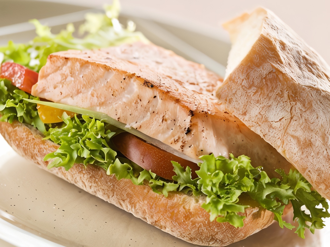 Grilled Salmon Sandwiches with Arugula, Tomatoes, and Avocado Cream