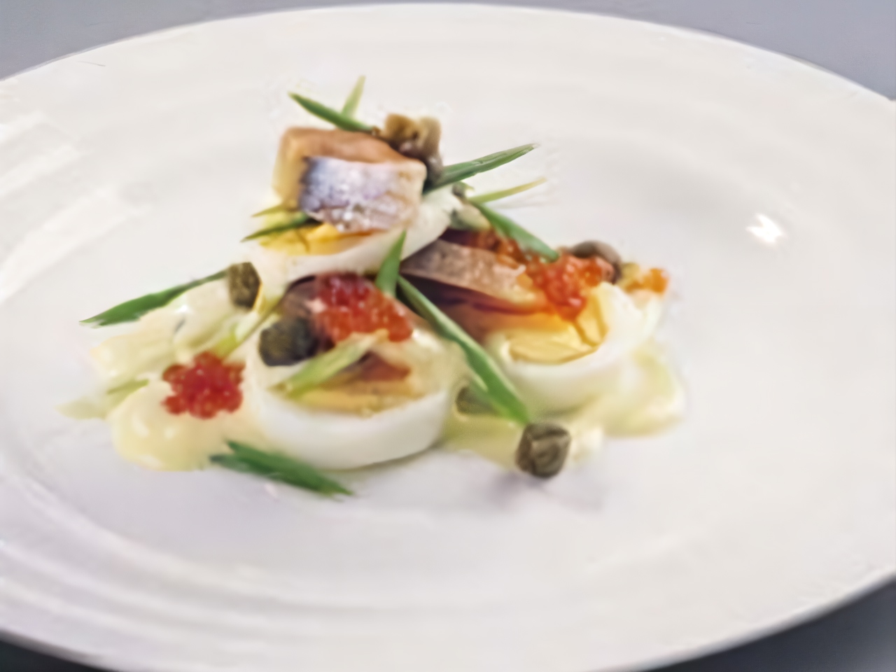 Layered Salad with Norwegian Herring, Eggs, and Capers