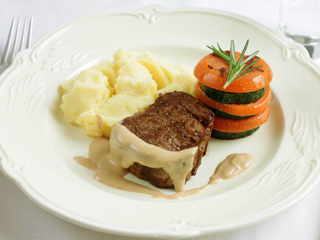 Steak with Pepper Sauce, Mashed Potatoes, and Zucchini-Tomato Millefeuille