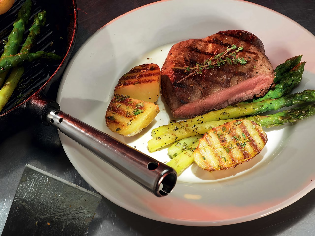 Grilled Steaks with Potatoes and Asparagus