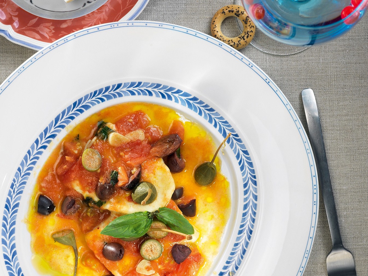 Warm Homemade Cheese in Tomato and Olive Sauce