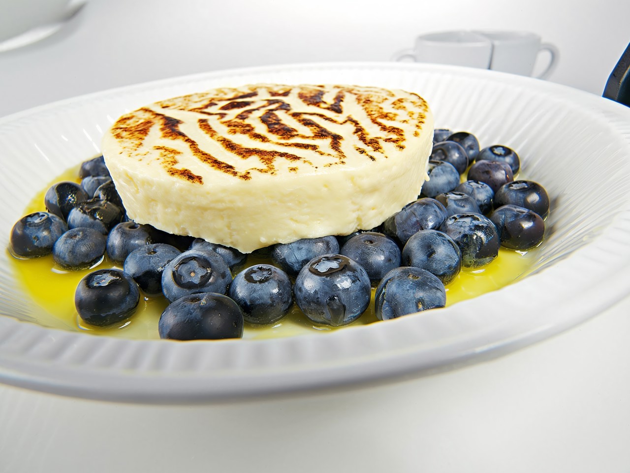 Warm Gratin with Blueberries and Orange Sauce