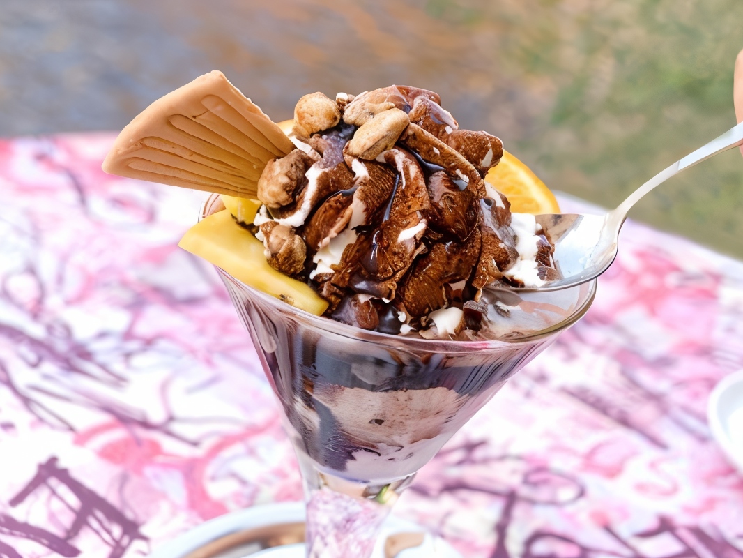 Warm Salted Caramel Sauce with Vanilla Ice Cream and Caramelized Nuts
