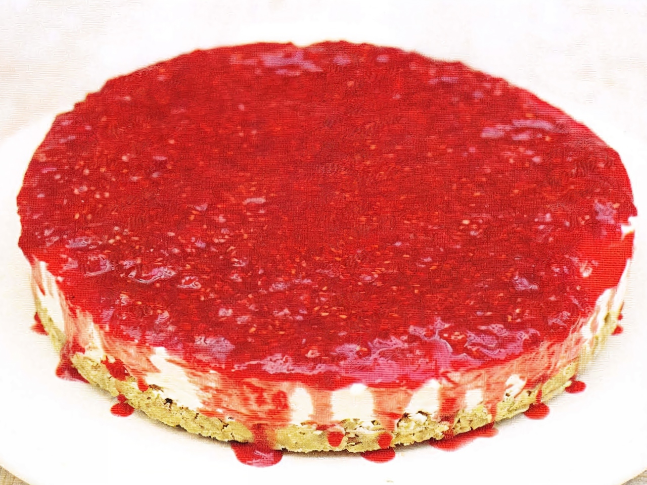 Vanilla Cheesecake with Raspberry Sauce
