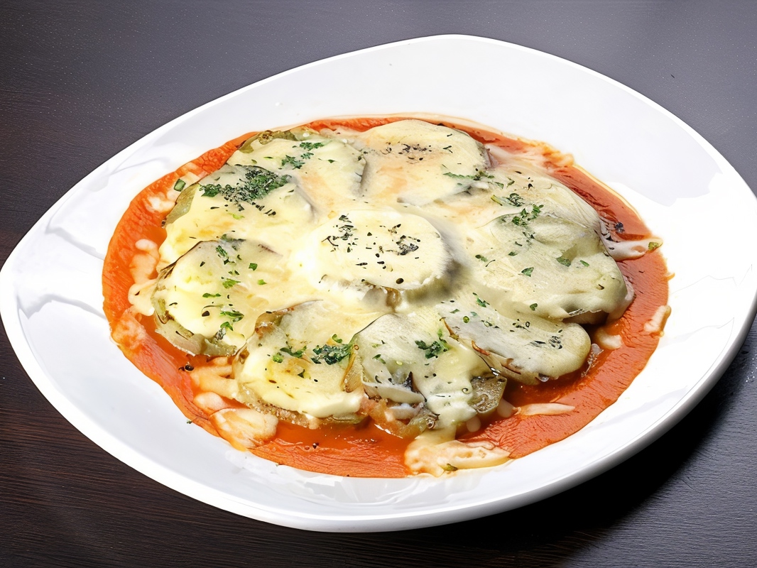 Baked Eggplants with Herbs, Tomato Sauce, and Parmesan