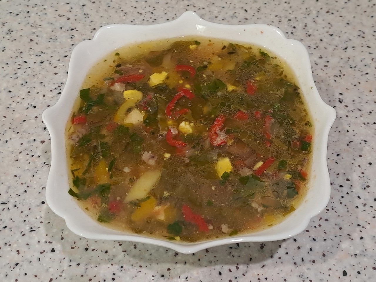 Green Borscht with Sorrel, Pumpkin, Parsley, and Bell Pepper in Meat Broth