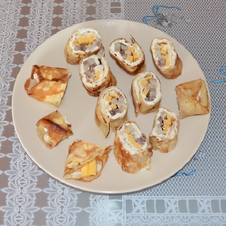 Роллы из блинов со сливочным сыром, семгой и авокадо