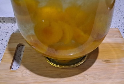 Фото шага рецепта Абрикосовый компот на зиму с апельсином и корицей 186593 шаг 10  