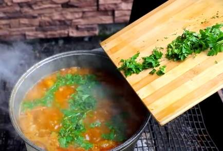 Фото шага рецепта Мясной суп с тыквой на костре 151528 шаг 9  