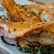 Морской окунь с зеленью в духовке